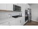 Bright kitchen featuring stainless steel appliances and white cabinets at 11809 Redpoll Trl, Noblesville, IN 46060