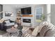 Cozy living room with a fireplace, mounted TV, and comfortable seating at 11809 Redpoll Trl, Noblesville, IN 46060
