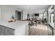 Open concept living/dining area features hardwood floors and plenty of natural light at 11809 Redpoll Trl, Noblesville, IN 46060