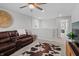 Upstairs living room featuring a leather sectional and natural light at 11809 Redpoll Trl, Noblesville, IN 46060