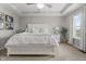 Beautiful main bedroom with soft lighting, neutral walls, plush carpet, a window, and a ceiling fan at 11809 Redpoll Trl, Noblesville, IN 46060