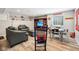 Cozy basement area with comfortable seating, entertainment center, decor, and light wood floors at 123 Bentree Blvd, Danville, IN 46122