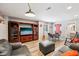 Finished basement boasts entertainment area with TV, comfortable seating, and dining table at 123 Bentree Blvd, Danville, IN 46122