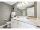 Bathroom featuring a double sink vanity with a large framed mirror at 123 Bentree Blvd, Danville, IN 46122