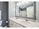 Bathroom featuring a double sink vanity with a large framed mirror and a separate toilet room at 123 Bentree Blvd, Danville, IN 46122