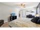 A bright bedroom featuring a ceiling fan, a television, a piano and two closets at 123 Bentree Blvd, Danville, IN 46122