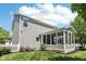 Well-maintained home exterior with a screened-in porch, lush lawn and white picket fence at 123 Bentree Blvd, Danville, IN 46122