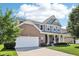 Beautiful two-story home with brick and siding, attached garage, and well-maintained landscaping at 123 Bentree Blvd, Danville, IN 46122