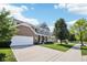 Inviting two-story home with a brick and siding exterior, a spacious driveway, and a well-kept lawn at 123 Bentree Blvd, Danville, IN 46122