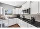This is a beautiful kitchen with stainless steel appliances, granite countertops, and white cabinets at 123 Bentree Blvd, Danville, IN 46122