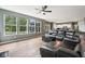 Open concept living space with hardwood floors, large windows, and connected to the eat-in kitchen at 123 Bentree Blvd, Danville, IN 46122
