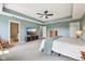 Spacious bedroom features a king bed, a large television, and ensuite bathroom access at 123 Bentree Blvd, Danville, IN 46122