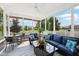 Relax on this screened-in porch with comfortable furniture and scenic views of the surrounding landscape at 123 Bentree Blvd, Danville, IN 46122