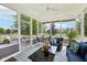 Enjoy the outdoors in this screened-in porch with comfortable seating and beautiful backyard views at 123 Bentree Blvd, Danville, IN 46122