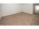 Empty bedroom with neutral carpeting and a window, providing a serene and adaptable living space at 1283 Clairet, Westfield, IN 46074