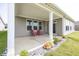 Covered patio has stone landscaping, 2 chairs, and view to yard and home's windows at 1283 Clairet, Westfield, IN 46074
