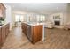Stylish kitchen island with stainless steel dishwasher overlooking an open floor plan dining area and living room at 1283 Clairet, Westfield, IN 46074