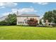 Spacious backyard featuring a well-maintained lawn, landscaping, and a patio area for outdoor enjoyment at 1345 Lewiston Dr, Westfield, IN 46074