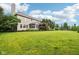 Expansive backyard with a lush green lawn, mature trees, and a soccer goal in the distance at 1345 Lewiston Dr, Westfield, IN 46074