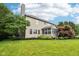 Large backyard featuring spacious lawn and sunroom at 1345 Lewiston Dr, Westfield, IN 46074