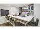 Basement bar boasts a modern design with stylish seating and a flat-screen TV at 1345 Lewiston Dr, Westfield, IN 46074