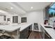 Finished basement with a modern bar featuring a countertop, cabinetry, and a view of the entertainment area at 1345 Lewiston Dr, Westfield, IN 46074
