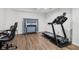 Finished basement featuring home gym area with treadmill and ping pong table at 1345 Lewiston Dr, Westfield, IN 46074