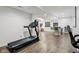 Finished basement with modern bar, lounge space, and exercise equipment at 1345 Lewiston Dr, Westfield, IN 46074