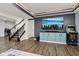 Finished basement with an entertainment area featuring a large screen TV and custom built-ins at 1345 Lewiston Dr, Westfield, IN 46074