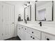 Stylish bathroom boasting a double vanity, black fixtures, and modern black framed mirrors at 1345 Lewiston Dr, Westfield, IN 46074
