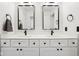 Bright bathroom featuring a double vanity with modern fixtures and stylish black framed mirrors at 1345 Lewiston Dr, Westfield, IN 46074