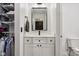 Modern bathroom with a sleek vanity, stylish mirror, and a separate toilet area at 1345 Lewiston Dr, Westfield, IN 46074