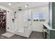 Modern bathroom featuring a glass enclosed shower with white subway tiles at 1345 Lewiston Dr, Westfield, IN 46074