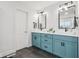 Bright bathroom features a double sink vanity with decorative black hardware and tiled flooring at 1345 Lewiston Dr, Westfield, IN 46074