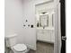 Modern bathroom showcasing a vanity with black fixtures and hexagonal floor tiles at 1345 Lewiston Dr, Westfield, IN 46074
