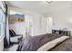 Comfortable bedroom showcasing a TV, accent chair, and access to adjoining rooms at 1345 Lewiston Dr, Westfield, IN 46074