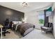 Cozy bedroom with a dark accent wall, comfy seating area, and a relaxing ambiance at 1345 Lewiston Dr, Westfield, IN 46074