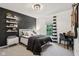 Cozy bedroom with striped curtains, a black accent wall, and shelves of collectibles at 1345 Lewiston Dr, Westfield, IN 46074