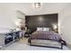 Stylish bedroom with dark accent wall, workspace, and decorative shelving at 1345 Lewiston Dr, Westfield, IN 46074