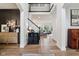 Bright foyer with staircase leading to the upper level, with hardwood floors and stylish decor at 1345 Lewiston Dr, Westfield, IN 46074