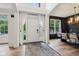 Inviting foyer with a grand entrance, leading into a dining area and beautiful hardwood floors at 1345 Lewiston Dr, Westfield, IN 46074