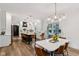 Bright, open kitchen featuring a large island, stainless steel appliances, and views of the dining area at 1345 Lewiston Dr, Westfield, IN 46074