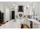 Bright kitchen features white cabinets, subway tile backsplash, and modern pendant lights at 1345 Lewiston Dr, Westfield, IN 46074
