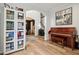 An open-concept living room featuring a staircase and piano. Access to the dining room is also visible at 1345 Lewiston Dr, Westfield, IN 46074
