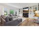 Cozy living room features built-in shelving, a fireplace and large windows at 1345 Lewiston Dr, Westfield, IN 46074