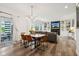 Open-concept living room featuring a dining area, fireplace, built-in bookshelves, and lots of light at 1345 Lewiston Dr, Westfield, IN 46074
