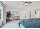 Sun-filled main bedroom features an entertainment console and a view into the en suite bathroom at 1345 Lewiston Dr, Westfield, IN 46074