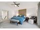 Open main bedroom features an en suite bathroom and stylish decorative accent wall at 1345 Lewiston Dr, Westfield, IN 46074