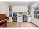 A well-appointed home office featuring built-in bookshelves, white cabinetry, and desk space at 1345 Lewiston Dr, Westfield, IN 46074