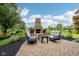 Outdoor brick fireplace and patio perfect for entertaining guests at 1345 Lewiston Dr, Westfield, IN 46074